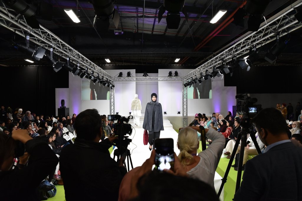 Female model on the catwalk of a modest fashion show at the Muslim Lifestyle Expo